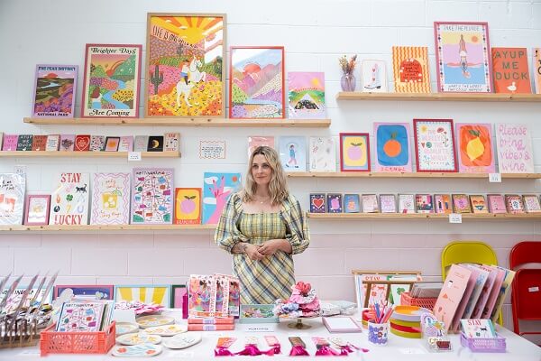 Woman In Dress Working In Book Shop