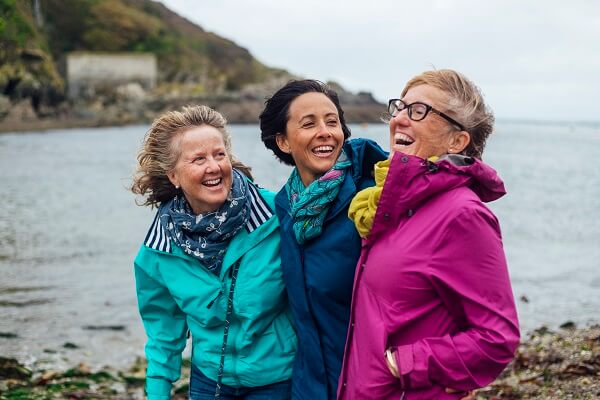 Three Women Outdoors Sea Looking Laughing