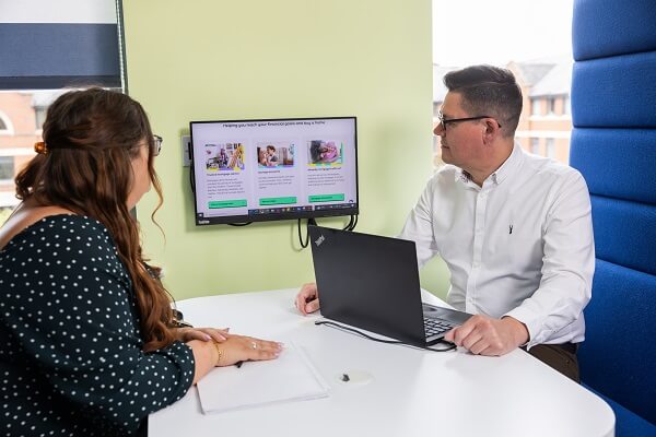 Two Colleagues Looking At Screen