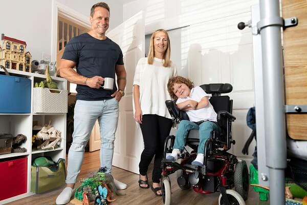 Couple With Boy In Wheelchair Tea