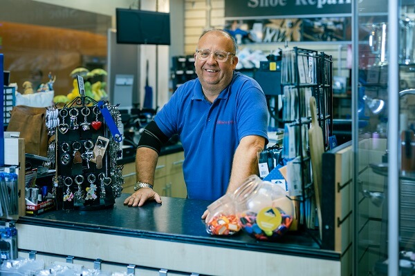 Man Blue Tshirt Shoe Repair Shop