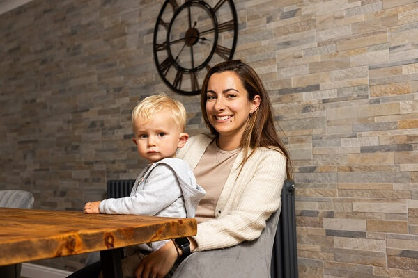 Mum And Son At Home Clock Brick Wall