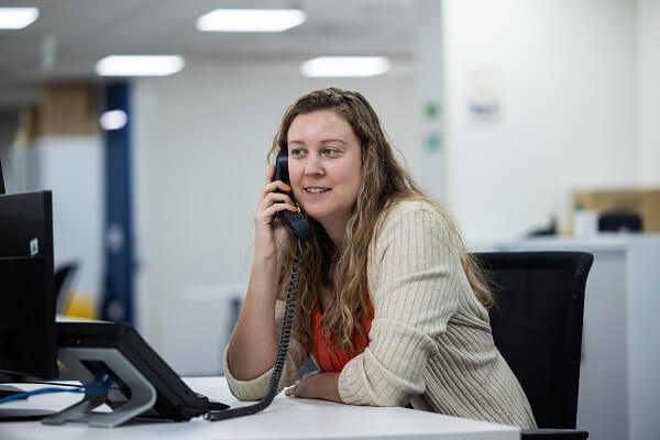 Colleage On Phone Looking At Screen